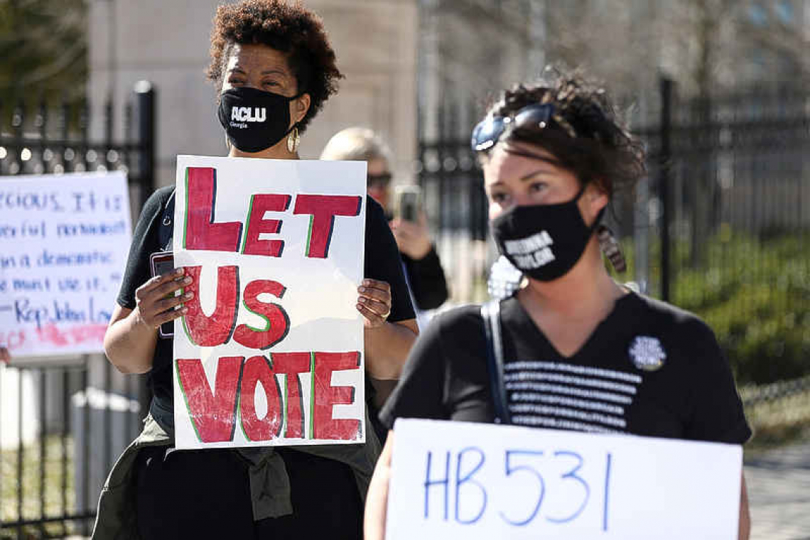 Biden attacks Georgia's new voting limits as 'an atrocity'